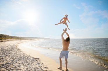 father and son at the beach